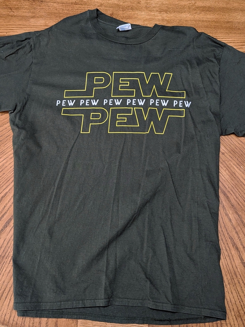 Port and Company Dark Green 'PEW PEW' Graphic Tee with Yellow Outline